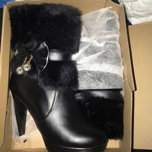 I am selling black furry heel boots.